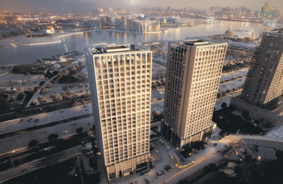 Stylish urban apartment building at Binghatti Moonlight with views of the glowing cityscape