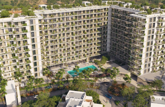 The exterior of California Residences, featuring tiered balconies with greenery and a landscaped entrance.