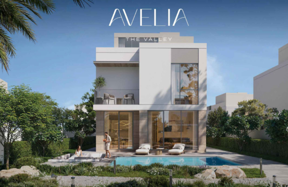 Residential view from a private balcony in The Valley, overlooking a landscaped community park with an outdoor fitness area and walking paths.