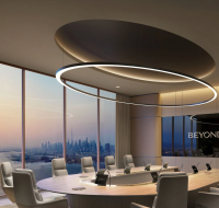 Exterior of 31 Above showing a glass facade and outdoor lounge area overlooking the sea.