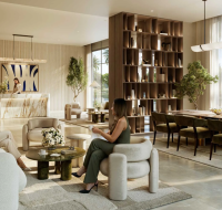 Elegant interior common area featuring a dining table, built-in shelving, and several comfortable seating groups.