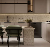 Modern open-plan kitchen with built-in appliances and sleek cabinetry