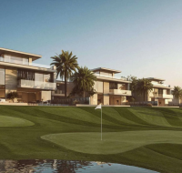 Luxury homes overlooking a manicured golf course and water feature .