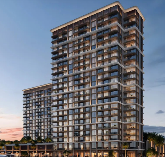 BAYSTAR residential building overlooking a marina with yachts at sunset.