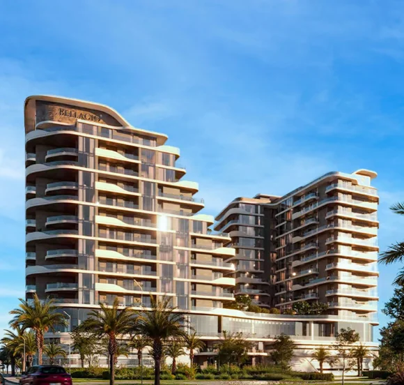 A modern residential building with a curved, layered facade, surrounded by palm trees under a clear sky.