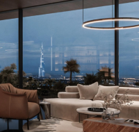 Contemporary living space with a city skyline visible at night.