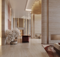 Elegant lobby with fireplace, neutral tones, and soft lighting