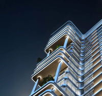 A close-up night view of a modern high-rise with curved balconies, sleek lighting, and glass façades.