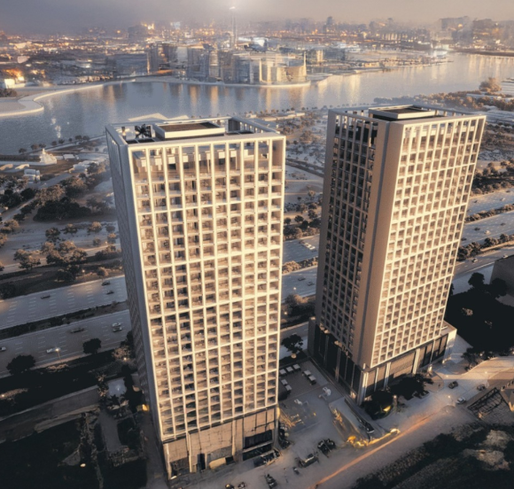 Stylish urban apartment building at Binghatti Moonlight with views of the glowing cityscape