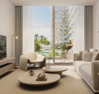 Modern apartment living room with a neutral sofa, TV, and large window overlooking a communal pool and building.