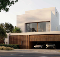 A contemporary villa in Dubai Investment Park 2 with large glass doors opening to a private garden and pool.