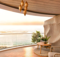 Modern residential tower offering coastal views at sunset