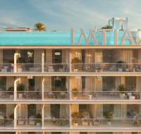 Outdoor pool with relaxing sun loungers and clear blue water