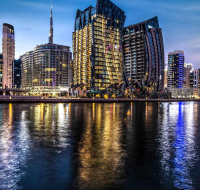 An evening view of the DaVinci Tower, a prominent architectural landmark in the Business Bay skyline.