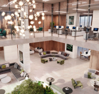 Modern office lobby with a two-story design, plush seating, and stylish lighting