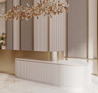 Contemporary living space featuring light-colored furniture and warm accents.