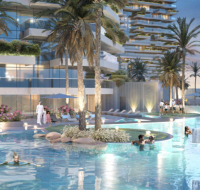 Infinity pool with people relaxing amid palm trees and greenery