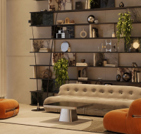 Spacious lounge with curved seating, modern lighting, and indoor greenery