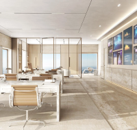 Grand office lobby with a high ceiling, polished marble floors, and a sleek reception desk