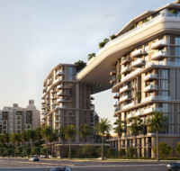 The exterior of the MJL Nourelle residential towers, connected by a striking sculptural skybridge.