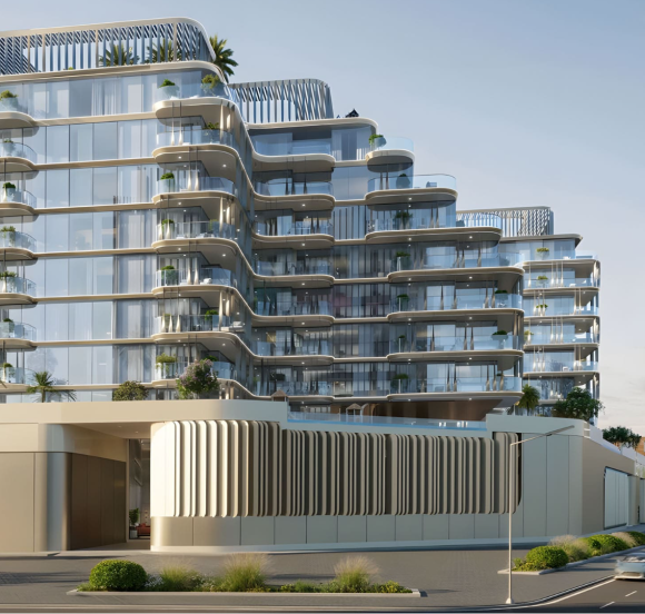 Modern residential buildings with glass balconies and landscaped grounds.