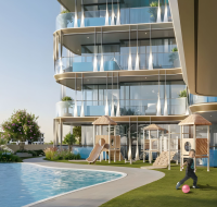 Luxury apartment building with pool, green lawn, and kids playground.