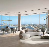 Bright living and dining area with panoramic sea and skyline views