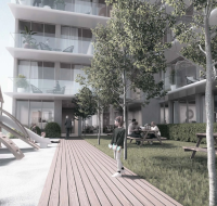 An aerial view of the lush, green Jumeirah Village Circle community, showing its parks, infrastructure, and easy access to local amenities.