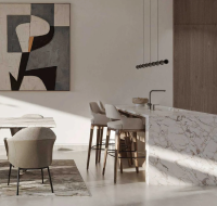 Gourmet kitchen and dining area with marble island and abstract art at Pinewood Estate Homes.