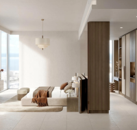 Modern bedroom with floor-to-ceiling windows, built-in wood wardrobes, and a view of the sea.