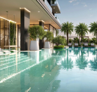 Luxury outdoor swimming pool with lounge chairs and greenery