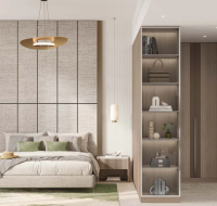 Spacious bedroom with large windows and soft lighting.