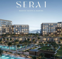 A modern residential building with a nautical-inspired design, situated directly on the waterfront at Rashid Yachts & Marina.