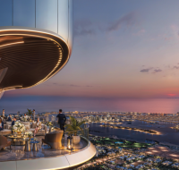 The stunning rooftop terrace at Shahrukhz, offering panoramic views of the Palm Jumeirah and the coastline at sunset.