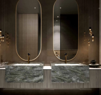 Modern master bathroom with unique pendant lighting and a floating vanity with dual sinks.