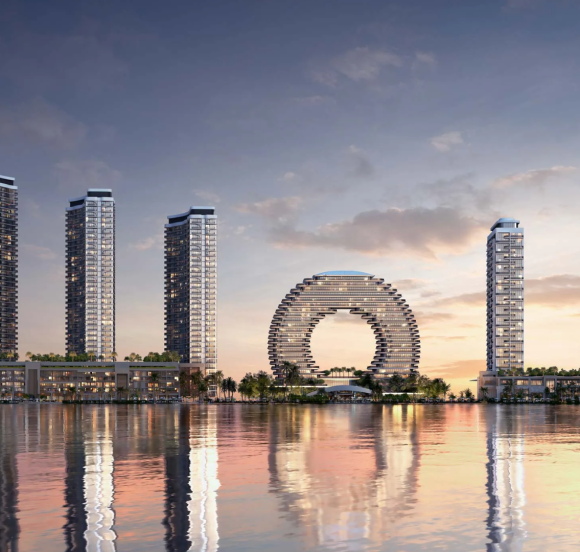 The skyline view of Sobha AquaCrest towers by Sobha Realty reflected in the water, showing the entire waterfront development.