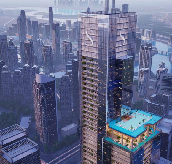 The main Sobha SkyParks skyscraper and the surrounding dense urban cityscape, viewed from above.