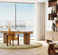 Modern outdoor patio with lounge chairs, table, and poolside seating .