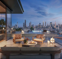 Outdoor lounge area at Solaya with comfortable seating and the Burj Khalifa and city view in the background.