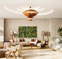 Contemporary building entrance and reception area with stylish lounge seating and polished stone flooring.