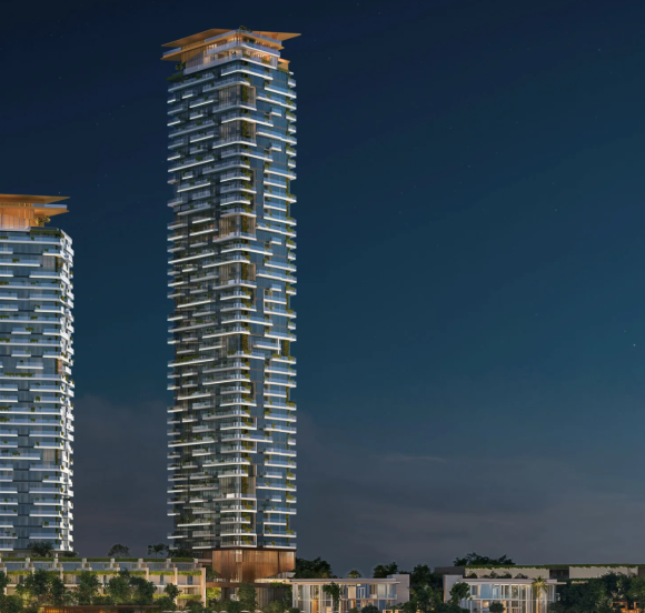 Night view of the two gleaming Soulever by Beyond towers, a luxury residential project in Dubai Maritime City.