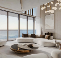 Interior of a Soulever luxury apartment showing a stylish modern lounge overlooking the sea.