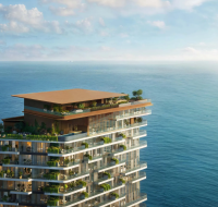 Close-up of the upper floors of the Soulever by Beyond tower, showing the luxury rooftop terrace and pool area with the vast ocean extending to the horizon.