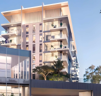 Corner perspective of sleek high-rise building with private balconies
