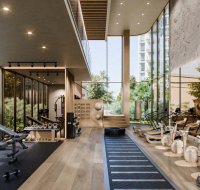 Bright workout space featuring large windows and minimalist design