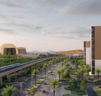 An urban view with mid-rise buildings, palm-lined roads, an elevated train, and a large dome in the distance.
