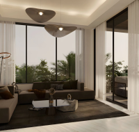 Cozy living room with floor-to-ceiling windows and garden view