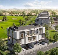 Aerial view of modern townhouses overlooking golf course and greenery
