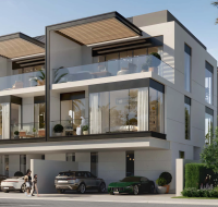 Modern townhouse exterior at Terra Golf Collection Phase 2 with glass balconies and parking