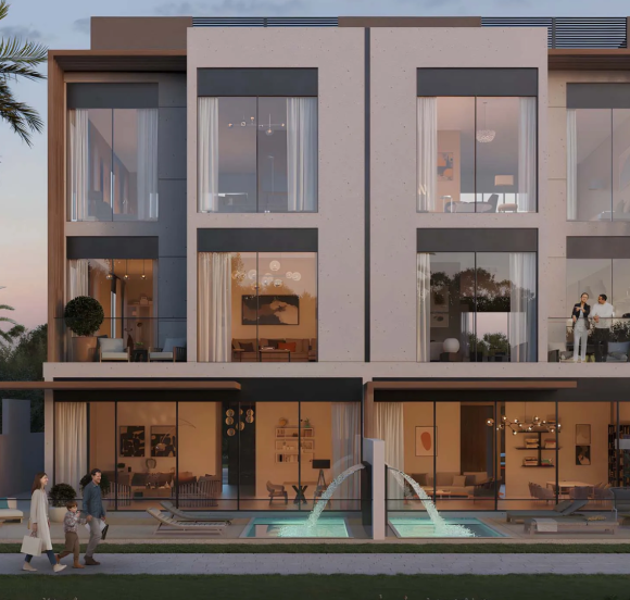 Evening view of townhouse with pool at Terra Golf Collection Phase 2